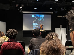 Chicago poet Imani Elizabeth Jackson presenting a poetry reading.