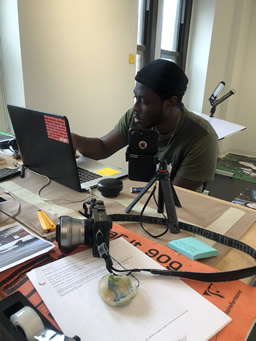 Former Artist-in-Residence Kelvin Haizel working in studio